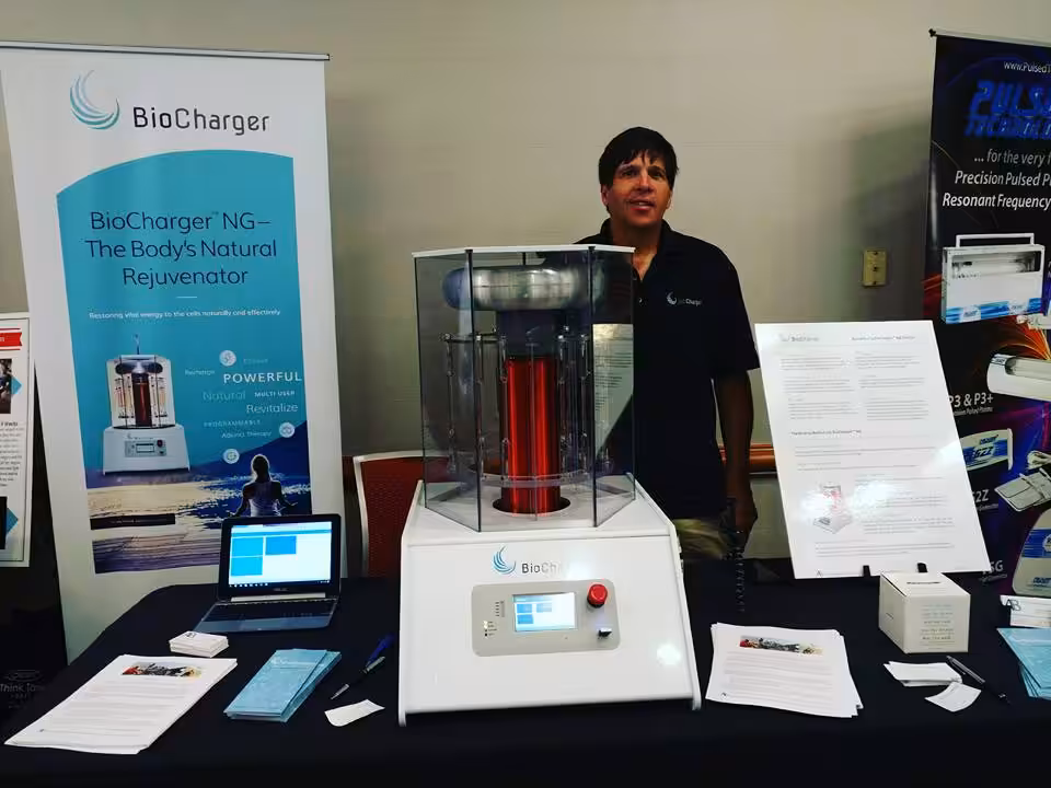 Jim Girard Standing Behind the BioCharger NG Device
