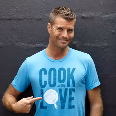 Pete Evans Showing his T-Shirt and Smiling