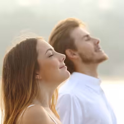 Female and Male Smiling Peacefully and Looking Upwards