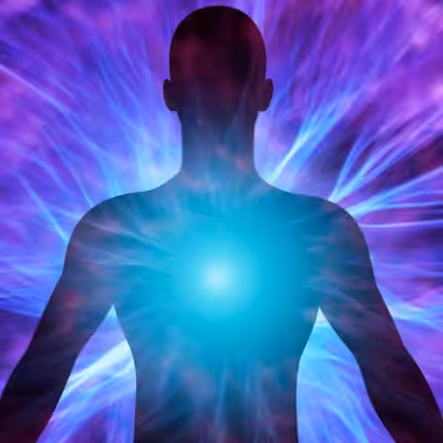 Silhouette of a Man In Front of Blue and Purple Electric Universe