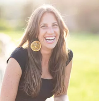 Lindsay Grossman Social Media Marketing of the BioCharger Smiling in Nature