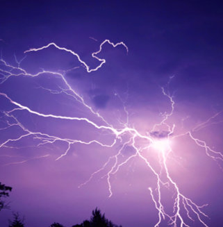Multiple Lightning Strokes on a Purple Night Sky