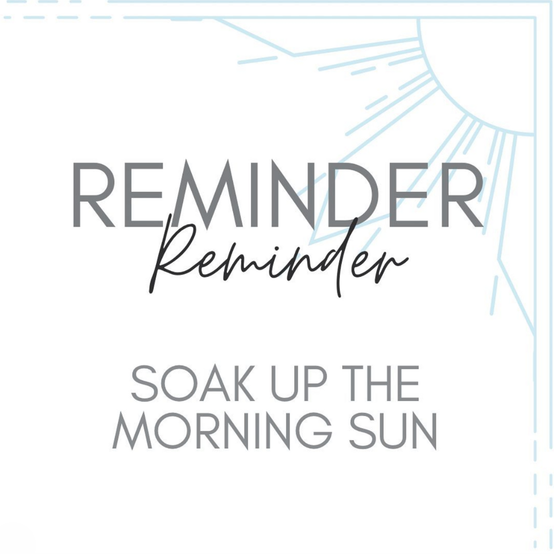 Reminder Soak Up The Morning Sun Text on a White Background With Light Blue Sun Outlines