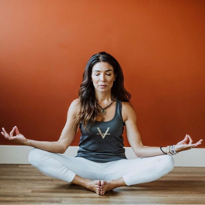 Stephanie Lucero-White Owner of Vibe Wellness Practicing Yoga