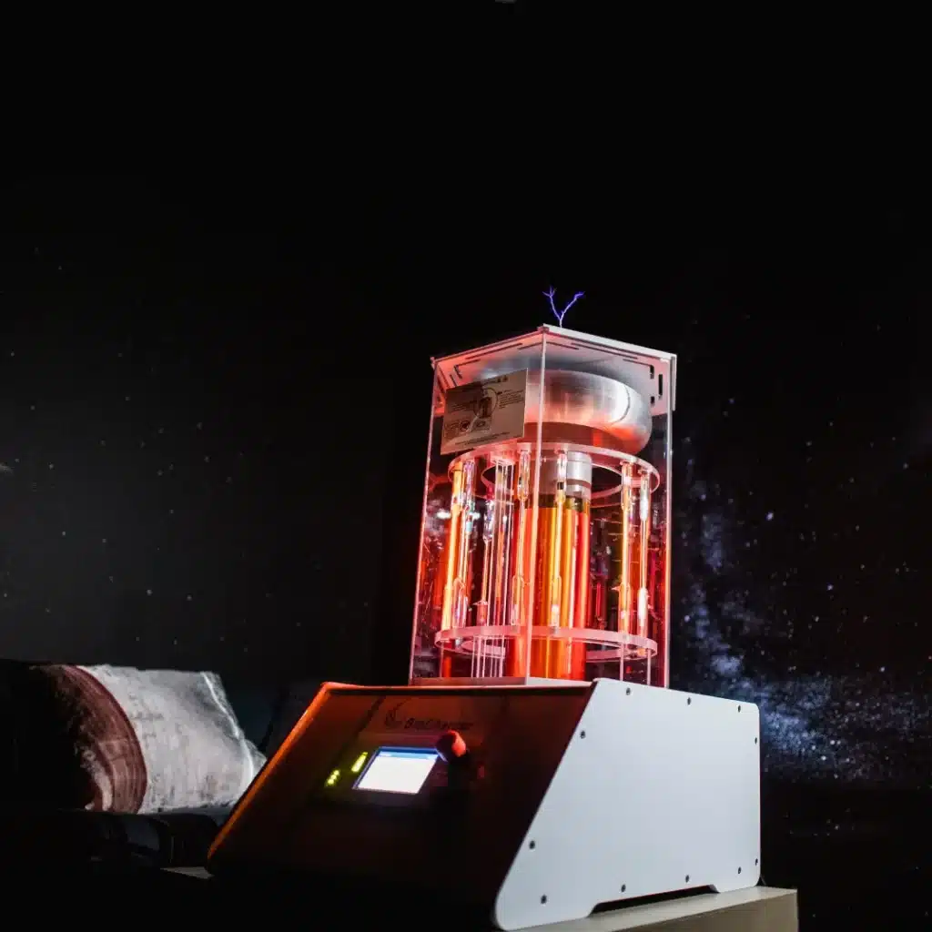 Dark lit room with a space like feel with the center attention to a BioCharger that is radiating yellow and red lights and a purple arc of electricity coming from the top