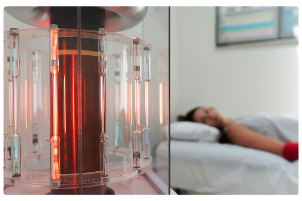 woman laying on a bed in the background in front of a BioCharger with tubes