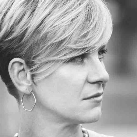 Black and white image of a woman staring out in the distance