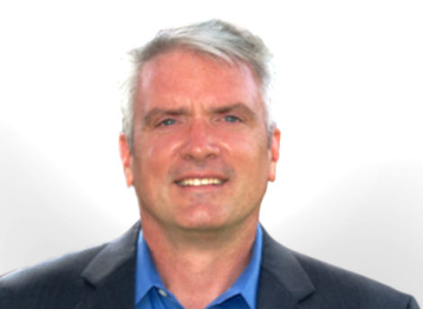 Image of a gentle man with grey hair and blue eyes on a white background